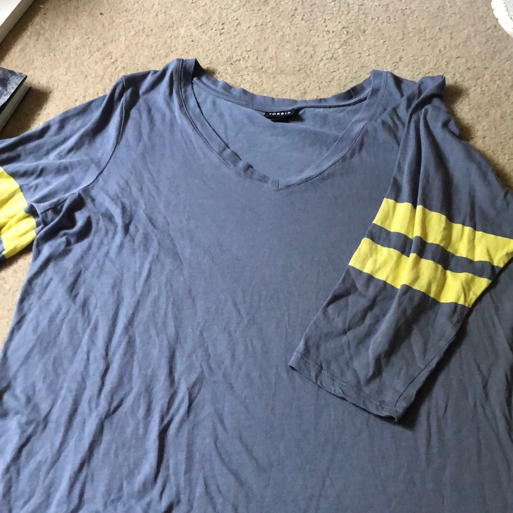 Torrid shirt size 2 yellow stripes on arm.
